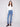 Blue jeans featuring a stylish flare leg with colorful floral embroidery, crafted in stretch denim for comfort by Charlie B.