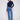 Medium blue jeans with flare fit and a dark top, featuring long length for a chic look by Charlie B.