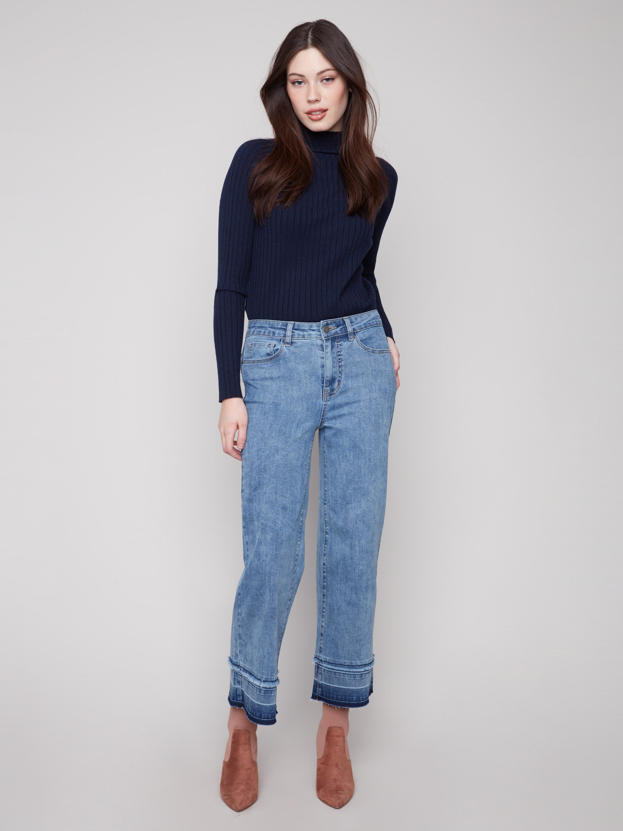 Medium blue jeans with a cropped length and stylish fringe details at the hem, perfect for casual outings by Charlie B.