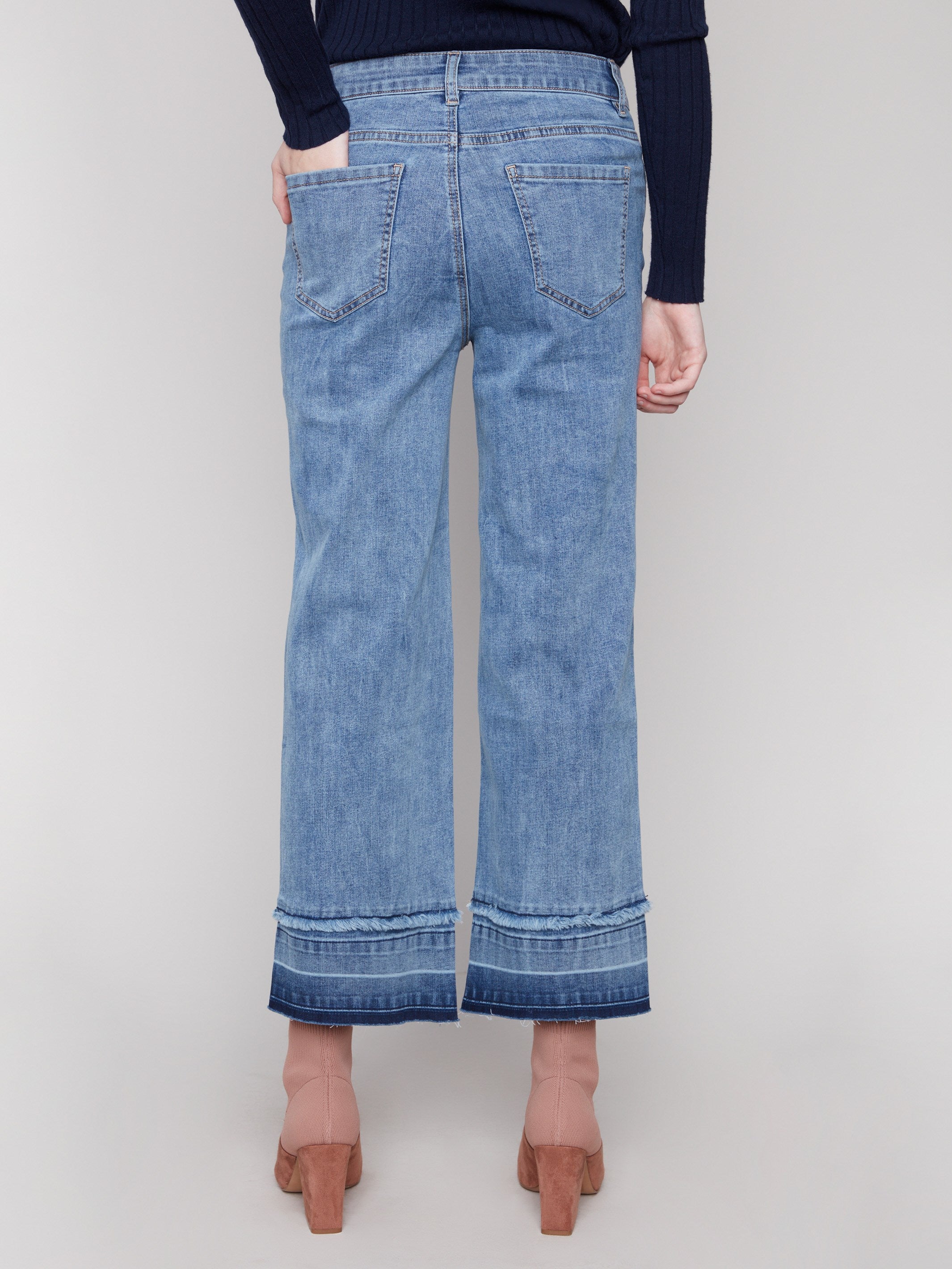 Showcasing a classic five-pocket style, these medium blue jeans are versatile and chic for any occasion by Charlie B.