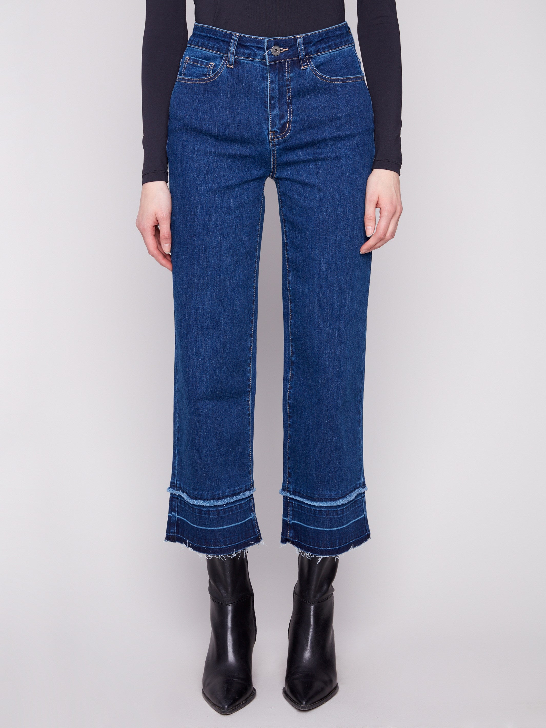 These jeans boast fringe details at the hem, adding a unique touch to your casual outfit by Charlie B.