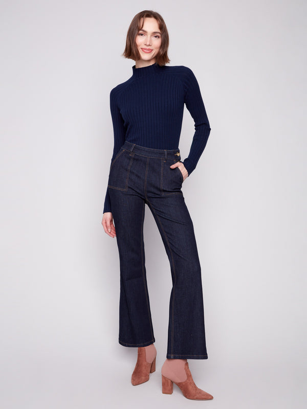 Dark blue denim jeans with a flattering flare fit, featuring stretch material for added comfort by Charlie B.