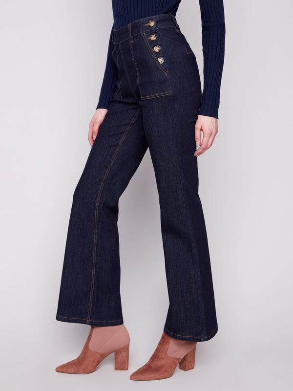 Elegant side button closure on these deep blue denim jeans adds a touch of sophistication by Charlie B.