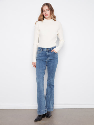 Flare fit jeans in stretch denim with a button-zip closure, designed for a chic casual look by Charlie B.