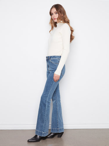 Regular rise stretch denim jeans offer comfort and style, ideal for any occasion. By Charlie B.