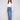 Medium blue jeans featuring a long length and stylish button accents, designed by Charlie B.