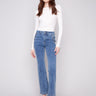 Medium blue jeans featuring a long length and stylish button accents, designed by Charlie B.