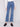 Stretch denim jeans in medium blue with unique button details, crafted by Charlie B.