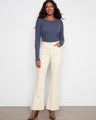 Long length stretch twill pants with a button-zip closure and natural flare leg design by Charlie B.