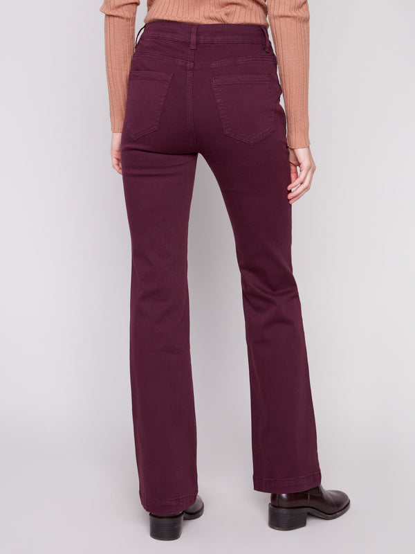 Berry flare leg twill pants with fashionable button accents on the side pockets for a unique look by Charlie B.