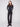 Black stretch twill pants with a long length and button details on the pockets by Charlie B.
