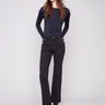 Black stretch twill pants with a long length and button details on the pockets by Charlie B.