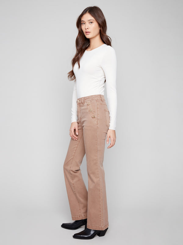 Crafted from stretch twill, these truffle pants provide a flattering fit with button details by Charlie B.