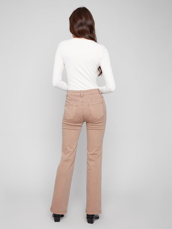 Designed with a regular rise, these truffle flare leg pants ensure comfort and elegance by Charlie B.