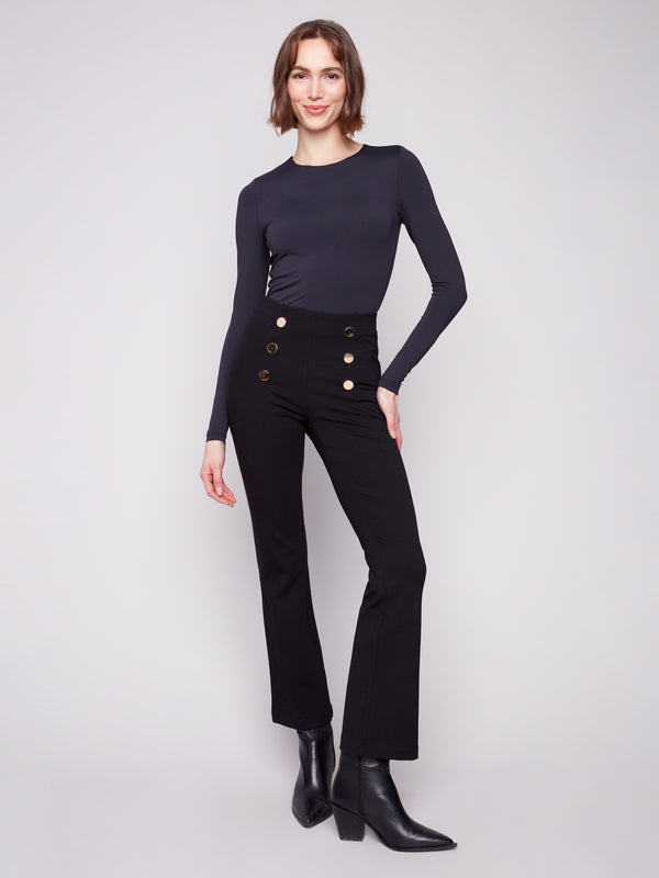 Black flare ponte pants featuring a comfortable elastic waistband and chic decorative buttons by Charlie B.