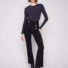Black flare ponte pants featuring a comfortable elastic waistband and chic decorative buttons by Charlie B.