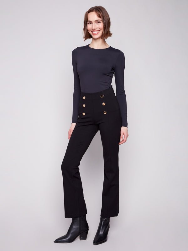 Fashion-forward black flare pants with an elastic waistband, adorned with eye-catching buttons by Charlie B.