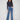 These medium blue jeans feature a stunning flare leg with floral embroidery, perfect for adding flair to any outfit by Charlie B.