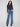 These medium blue jeans feature a stunning flare leg with floral embroidery, perfect for adding flair to any outfit by Charlie B.