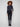 Charcoal flared jeans crafted from stretch denim material, featuring a floral washed hem and button closure by Charlie B.
