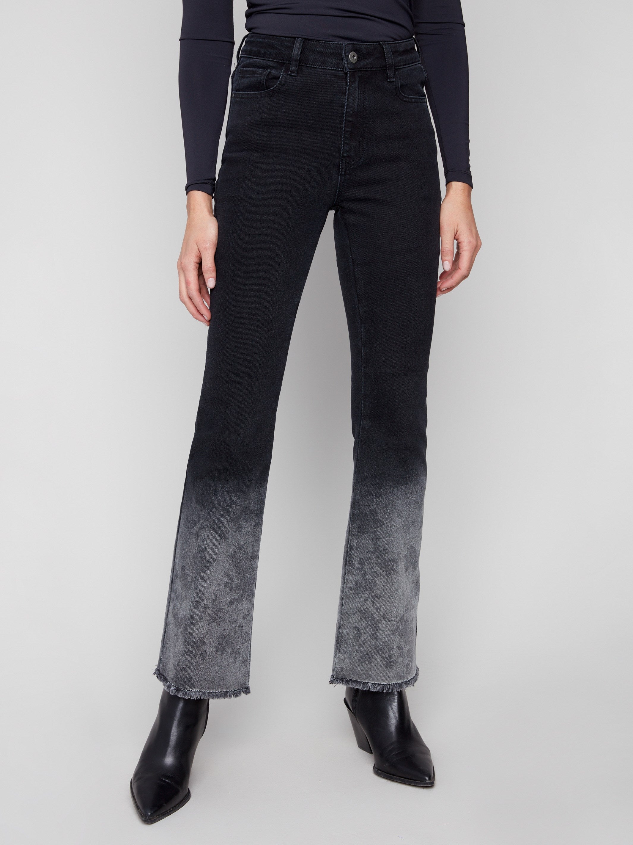 Flare leg charcoal jeans with a washed frayed hem, providing both comfort and style in stretch denim by Charlie B.