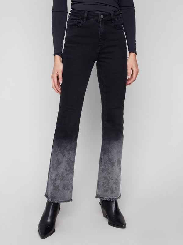 Flare leg charcoal jeans with a washed frayed hem, providing both comfort and style in stretch denim by Charlie B.