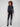 Five-pocket charcoal jeans with a unique floral washed hem, designed for everyday elegance by Charlie B.