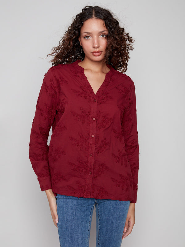 Cabernet blouse featuring a stylish V-neckline and detailed floral applique for a chic look by Charlie B.