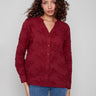 Cabernet blouse featuring a stylish V-neckline and detailed floral applique for a chic look by Charlie B.