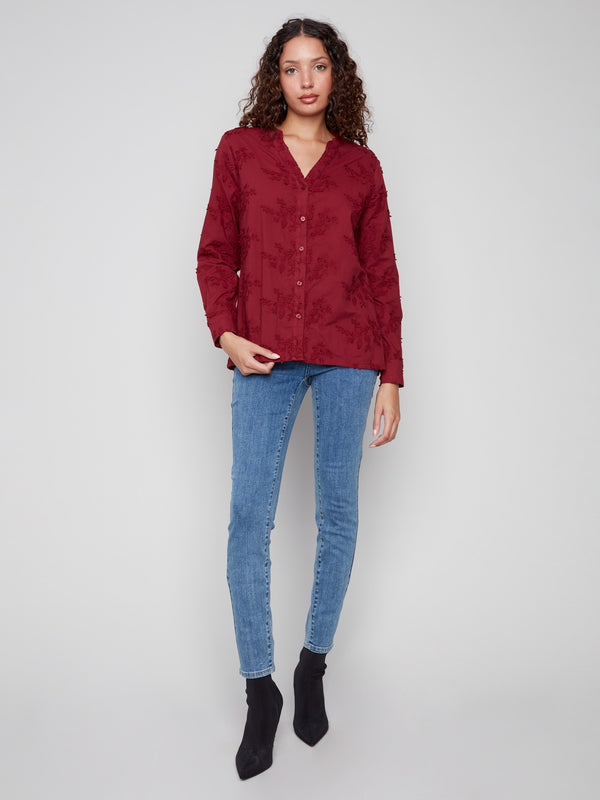 Elegant long-sleeve blouse in 100% cotton with intricate floral designs, perfect for any occasion by Charlie B.