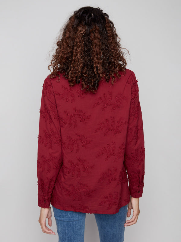 Chic cabernet blouse with floral patterns crafted from premium materials, offering comfort and style by Charlie B.