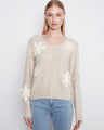 Almond sweater with long sleeves and delicate floral appliqués, perfect for a cozy look by Charlie B.