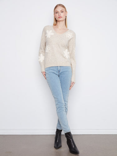 Stylish heather-almond sweater featuring drop shoulders and charming floral details by Charlie B.