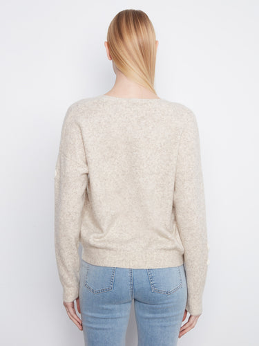 Elegant heather-almond sweater showcasing intricate floral designs for added charm by Charlie B.