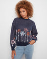Sweater with a cozy crew neckline, featuring a charming floral design in soft hues. Perfect for casual outings. By Charlie B.