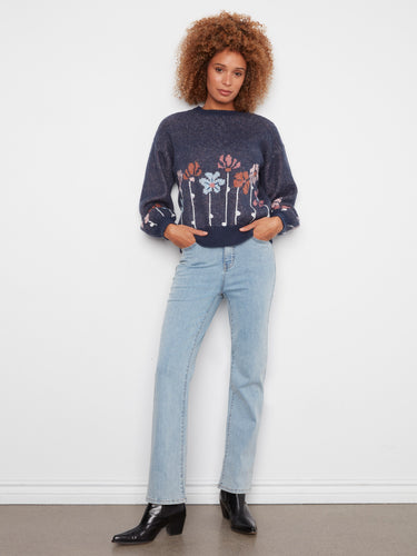 This sweater highlights drop shoulders, adding a relaxed vibe to the floral pattern. Ideal for layering during cool days. By Charlie B.