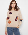 Heather-sand sweater adorned with ribbed hem and cuffs, featuring vibrant floral jacquard designs by Charlie B.