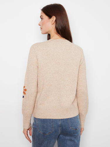 Chic heather-sand sweater featuring placed jacquard flowers, enhanced by its ribbed hem and cuffs design by Charlie B.