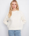 Buttercream sweatshirt with crew neckline and floral soutache design, perfect for a relaxed fit. Crafted with long sleeves by Charlie B.