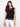 Elegant black top with a crew neckline, featuring intricate crochet design and cap sleeves for a stylish look by Charlie B.