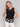 Black crochet top featuring a crew neckline by Charlie B.