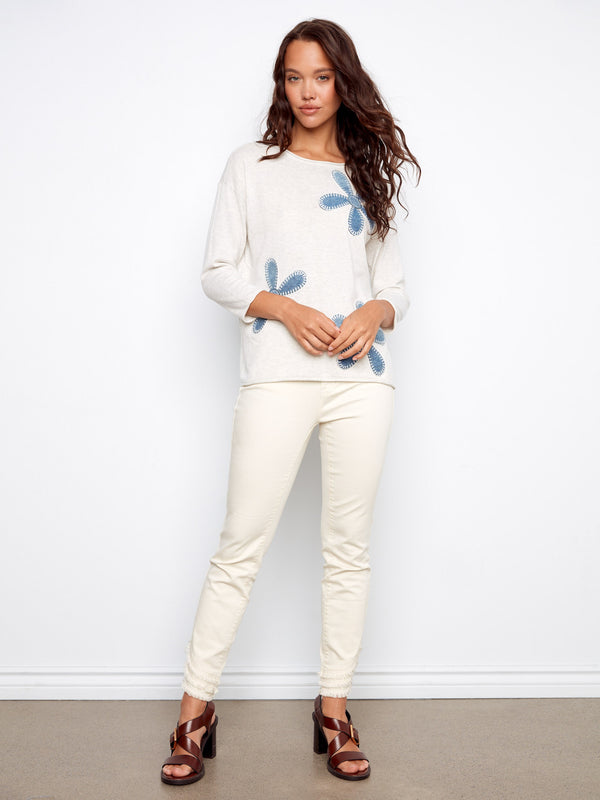 The crew neckline adds sophistication to this Heather Oat sweater with delicate floral embroidery by Charlie B.