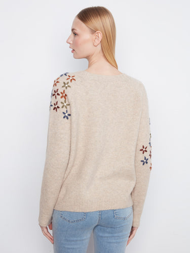 Chic beige sweater with beautifully embroidered flowers on the soft fabric sleeves by Charlie B.