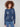 Denim sweater with a crew neck, showcasing a charming embroidered floral design, complemented by ribbed cuffs. By Charlie B.