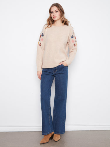 Adorned with ribbed cuffs and hem, this sweater combines comfort and style effortlessly, making it a versatile wardrobe staple by Charlie B.