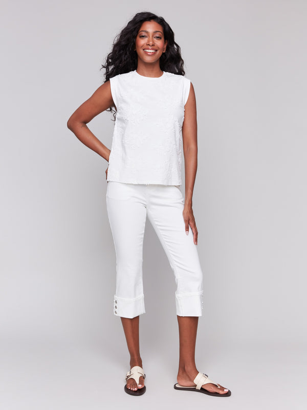 Stylish sleeveless design in white cotton by Charlie B.