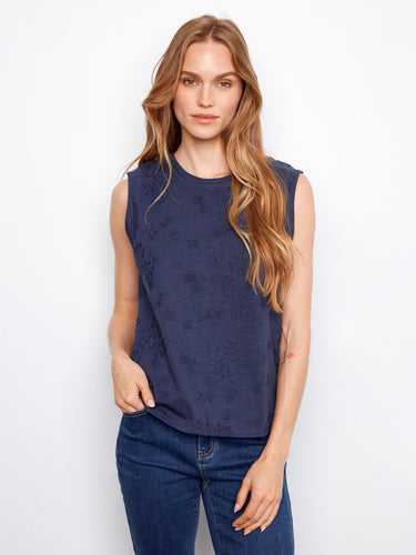 Navy sleeveless top crafted from cotton with intricate floral embroidery detailing by Charlie B.