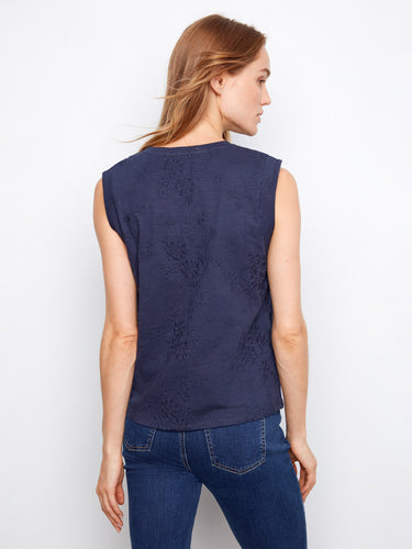 Cotton top in navy with embroidered floral patterns and stylish sleeveless cut by Charlie B.