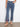 These cropped length jeans showcase intricate pixelated embroidery, perfect for a stylish and comfortable look. By Charlie B.