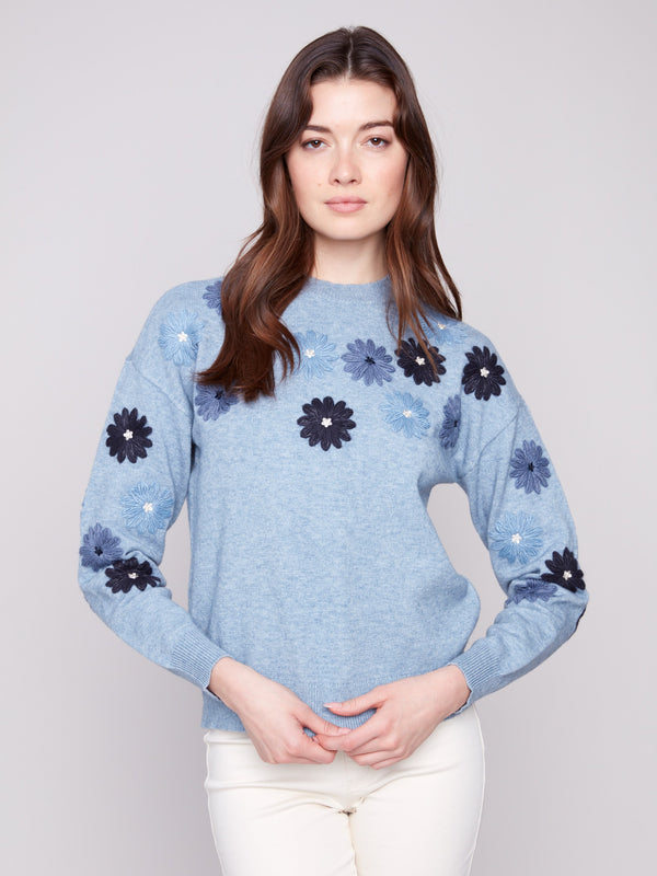 Heather denim sweater with floral embroidery, showcasing a relaxed fit design perfect for casual outings by Charlie B.